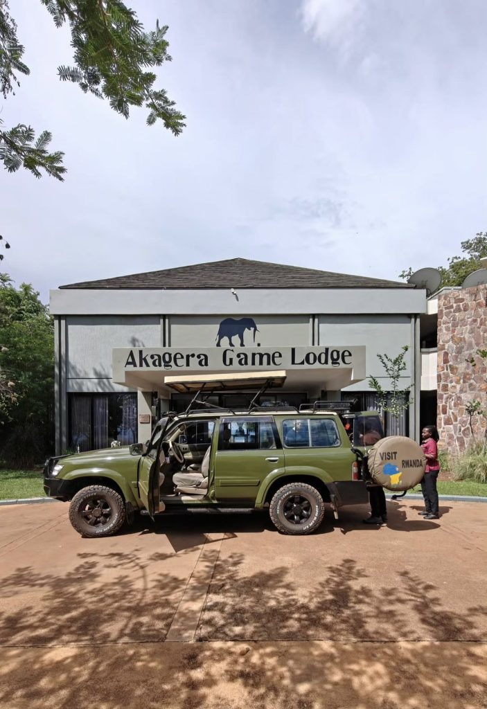 Huza Gateway vehicle parked in front of Mantis Akagera Game Lodge for guest check-in before a boat ride.
