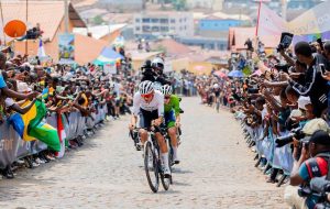Cyclists climbing the steep paved road in Kimihurura during the UCI Road World Championships 2025 in Kigali, Rwanda