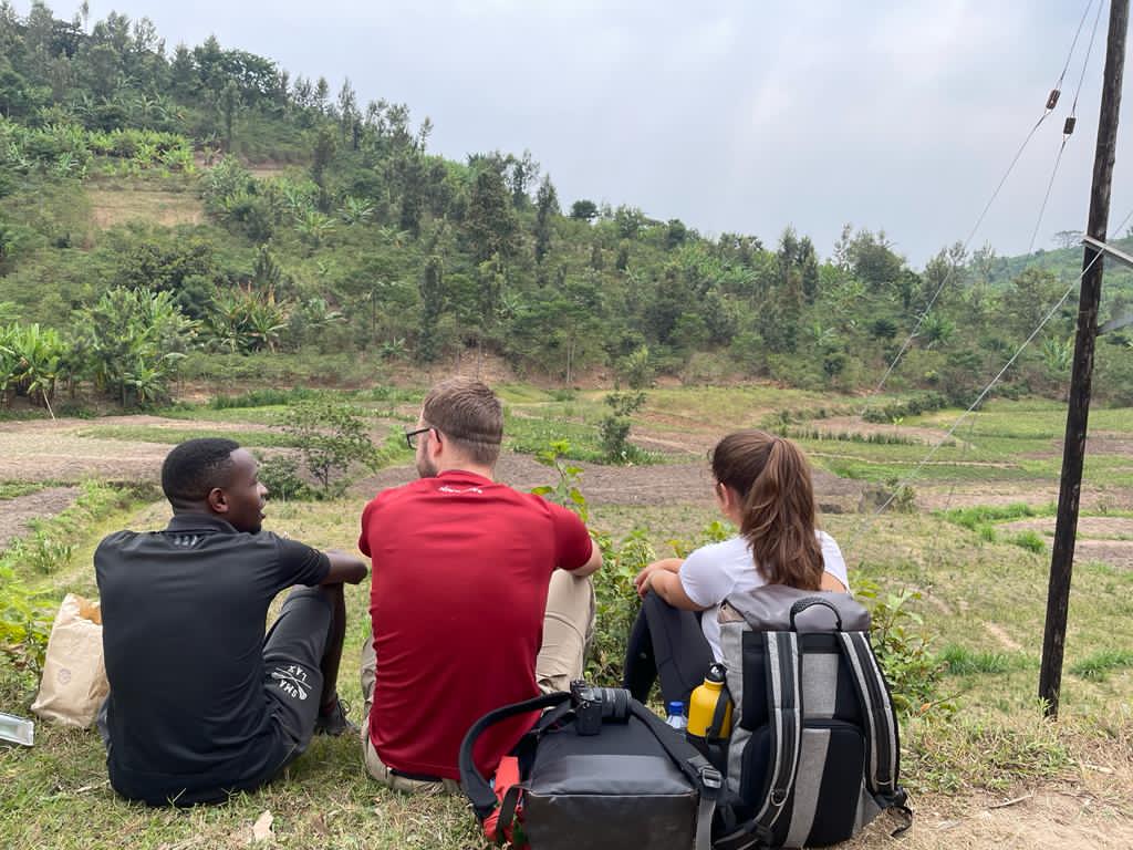 Traveler exploring the Congo Nile Trail in Rwanda with scenic Lake Kivu views during a hiking and biking adventure by Huza Gateway.